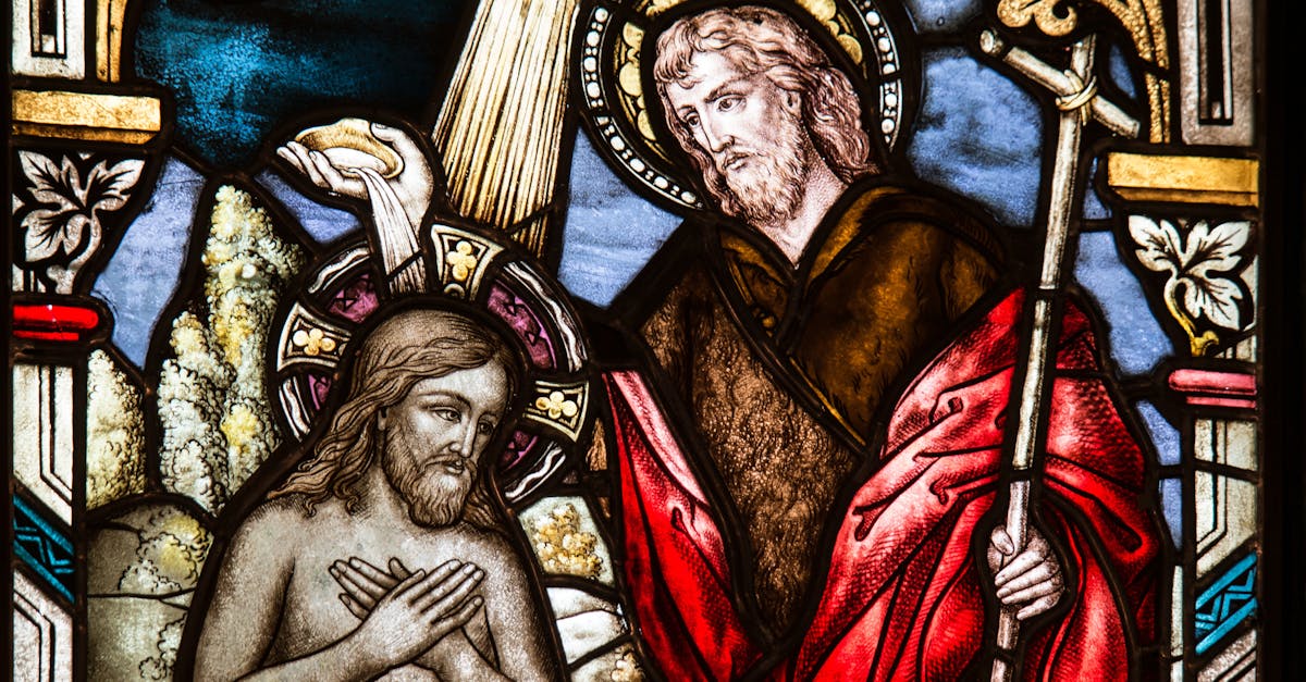 Depicts a detailed stained glass artwork featuring biblical scenes in vivid colors.