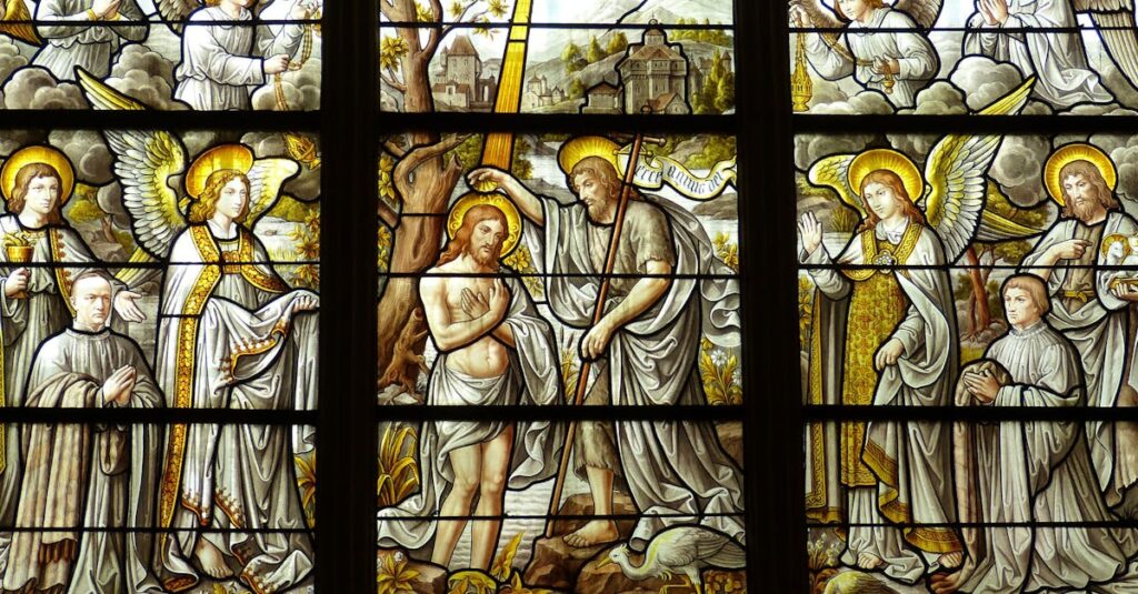 Detailed stained glass artwork illustrates biblical scenes in a church setting.